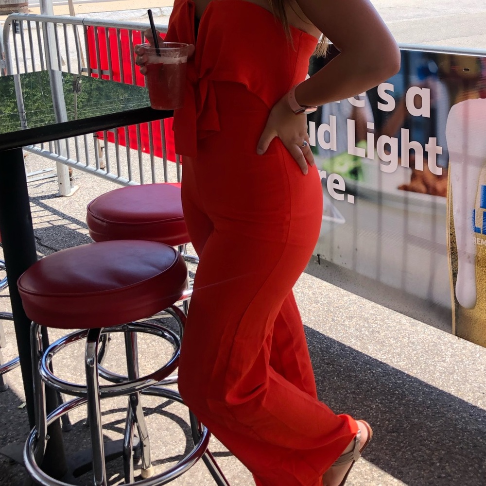 Bright orange jumpsuit, only worn 2 times, too small now